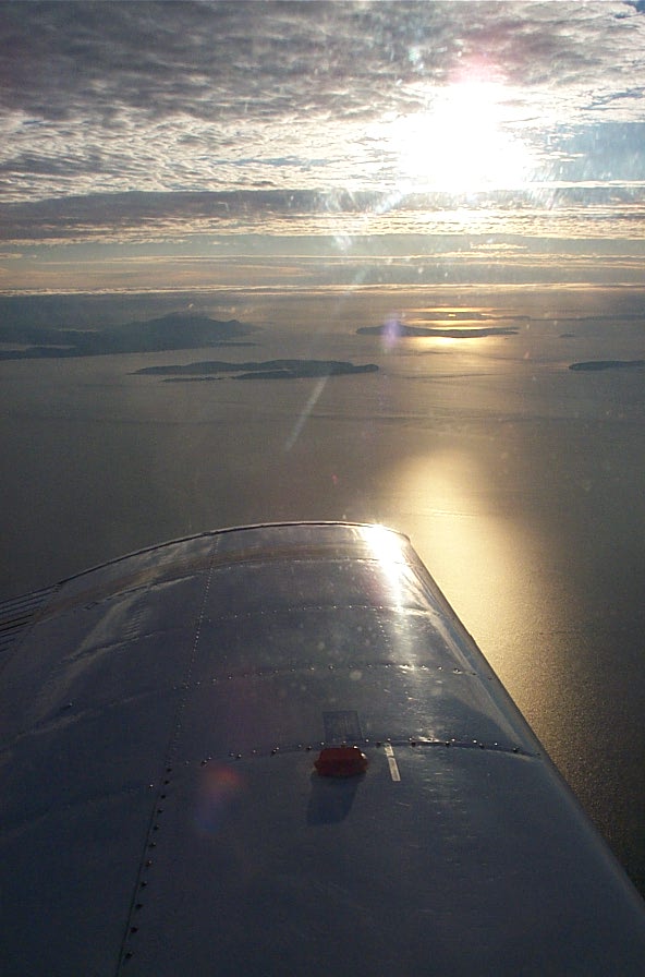 Wing of Cherokee GUKG over the Strait of Georgia during trianing flight.  December 3, 2008.  Langley Flying School.
